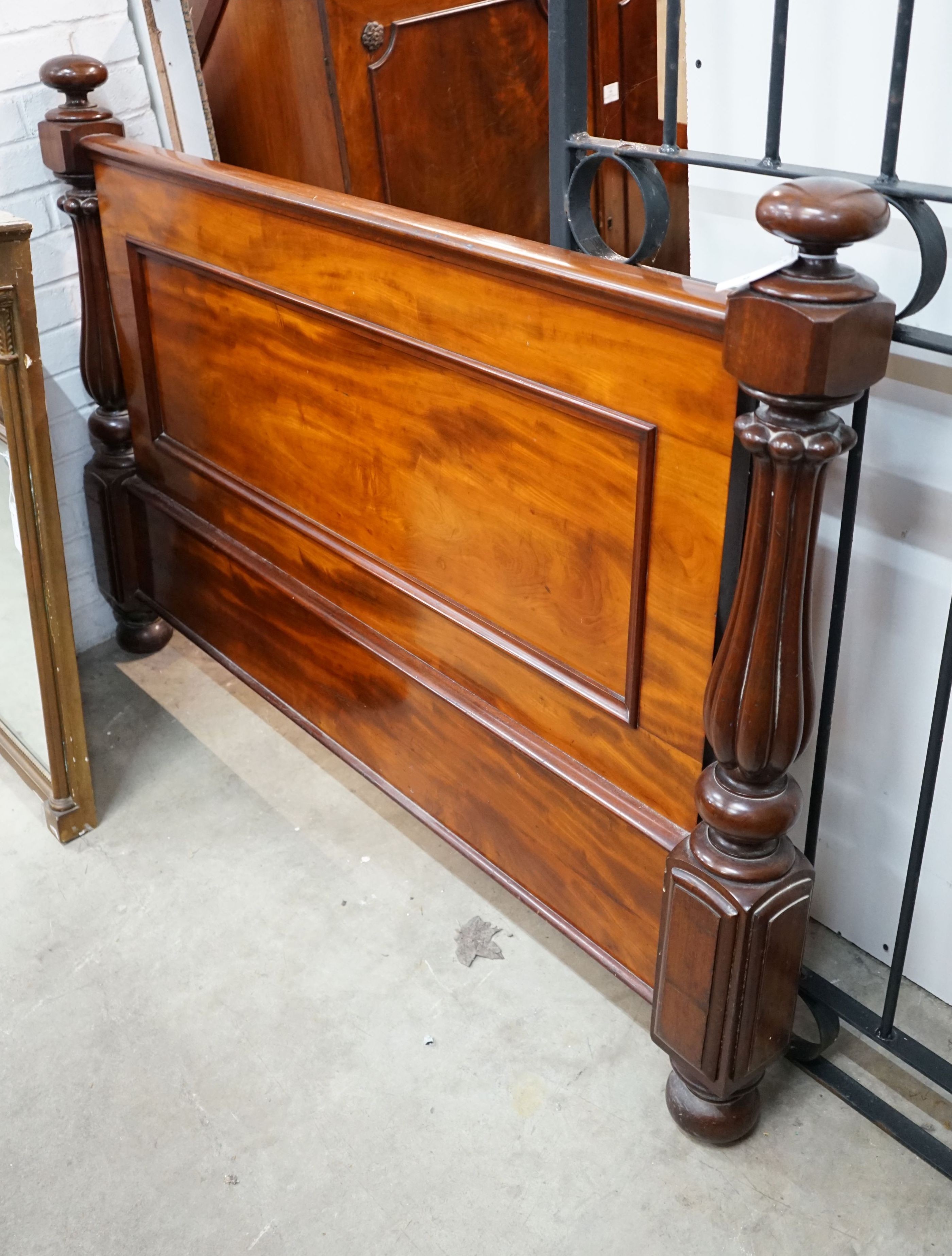 A Victorian mahogany footboard, width 154cm, height 106cm